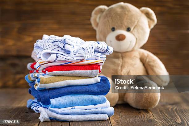 Baby Clothes Stock Photo - Download Image Now - Baby Clothing, Folded, 2015