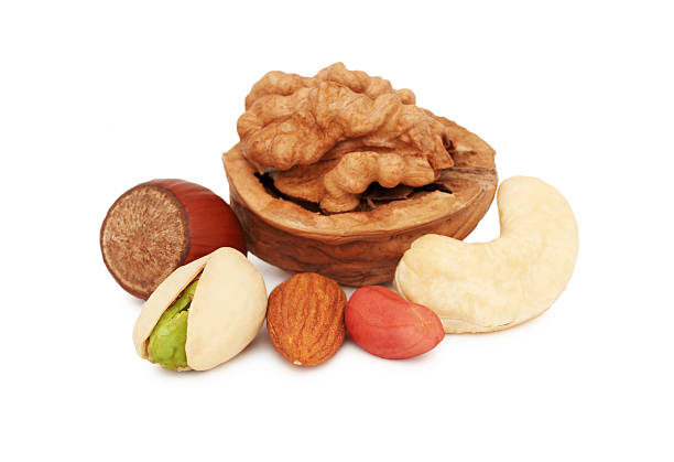 montón de diferentes tipos de frutos secos (aislado - walnut pod nutshell cross section fotografías e imágenes de stock