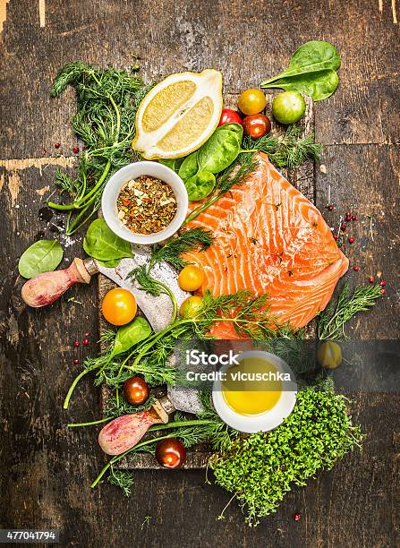 Salmon Fillet With Fresh Healthy Herbs Vegetables Oil And Spices Stock Photo - Download Image Now