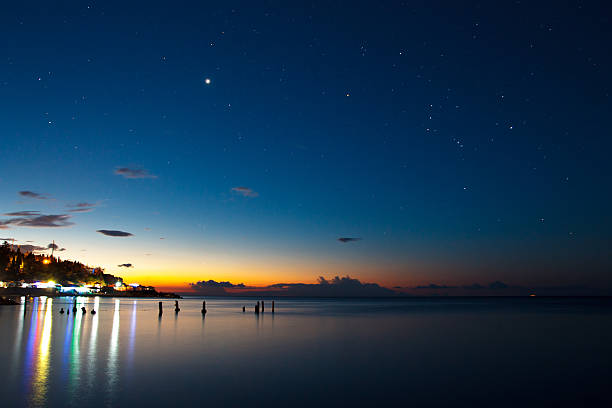 istock The sea and night lights on coast before sunrise 477042432