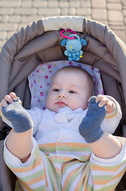 istock child is lying in a carriage 477042690