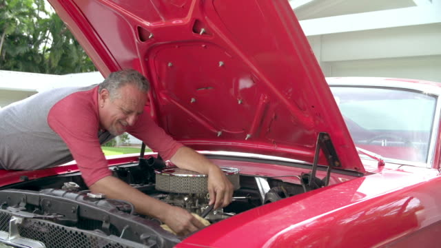 Retired Senior Man Working On Restored Car In Slow Motion