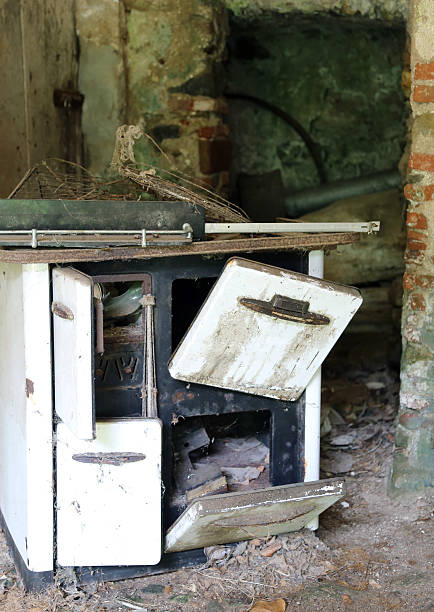 istock rusty wood-burning stove in an old abandoned house 477043220