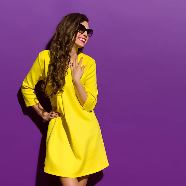 istock Smiling Young Woman On A Violet Background 477046862