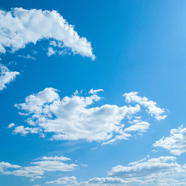 istock beautiful blue sky with clouds and sun 477047346