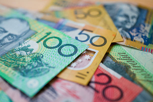 Australian money background Australian money background showing $100, $50 and $20 notes with a shallow depth of field. banknote stock pictures, royalty-free photos & images