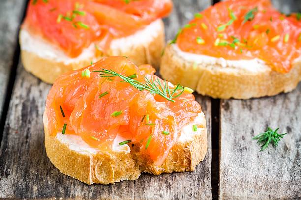 istock Appetizer canapes of baguette with smoked salmon 477049752