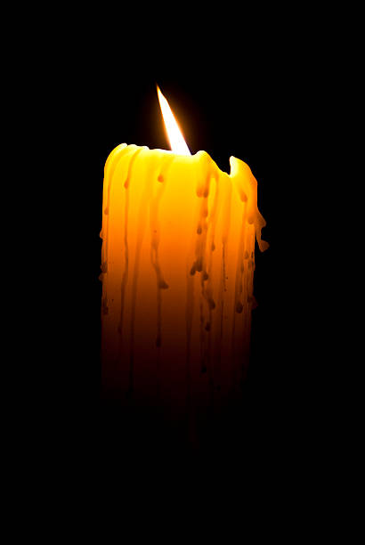 istock Candle burning in the dark 477050101