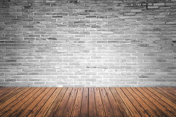 istock Old interior room with brick wall and wood floor 477050212