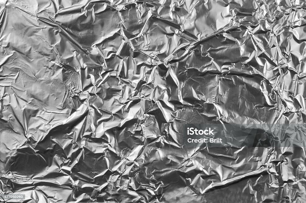 Abstract crumpled silver aluminum foil closeup background texture, grey horizontal Abstract crumpled silver aluminum foil macro closeup background texture, grey horizontal textured pattern Foil - Material Stock Photo