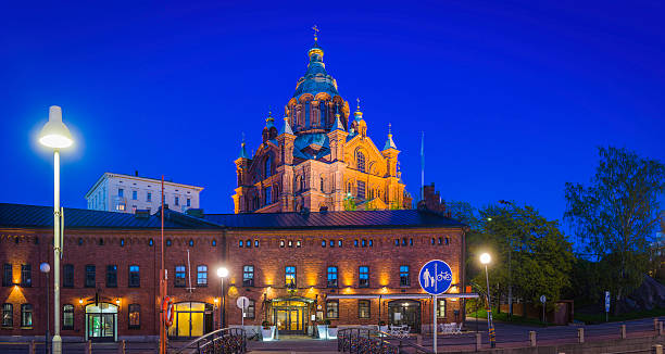 istock Helsinki Uspenski Cathedral waterfront warehouse restaurants illuminated dusk panorama Finland 477050330