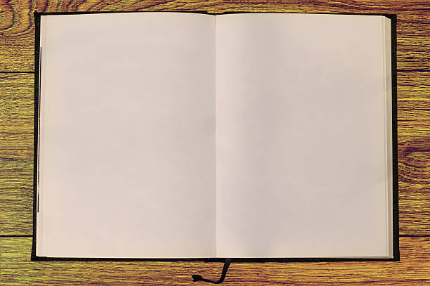 istock Blank spiral notebook on wooden material 477052880