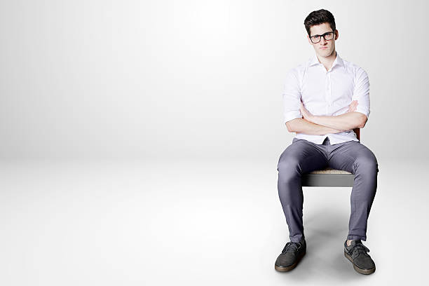 istock bored worker on little chair 477053890
