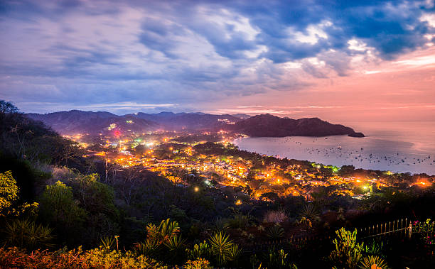 Beaches of Coco, Guanacaste, Costa Rica at dusk Looking down on Playas del Coco, Guanacaste, Costa Rica at night. costa rica photos stock pictures, royalty-free photos & images