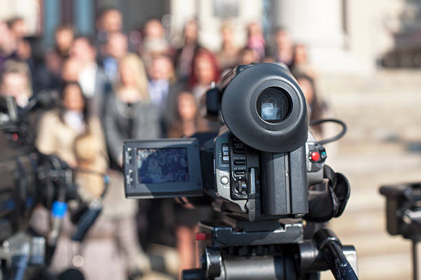istock Covering an event with a video camera 477056255