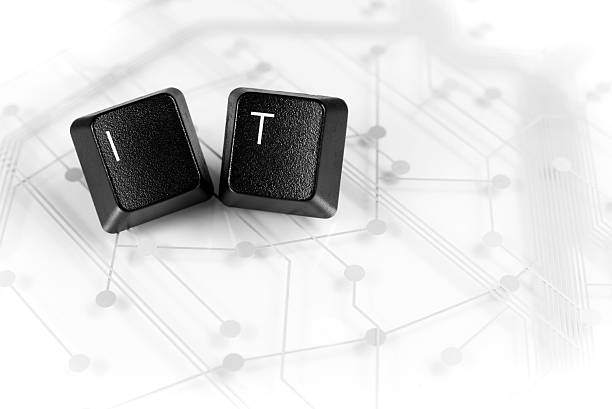 istock IT, Two Keyboard keys with letters IT on Circuit Board 477056338
