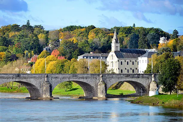 Old bridge of Wilson on the river Loire and church at Tours, city in central France, the capital of the Indre-et-Loire department, Centre region.