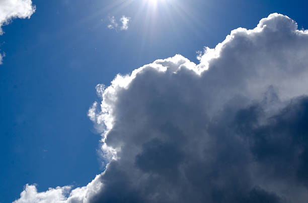 istock Dark blue sky and white summer clouds 477056734