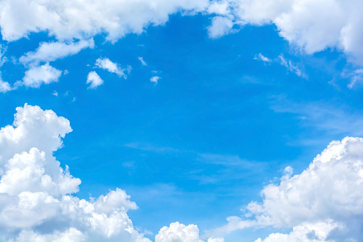 Photo of white clouds against a blue sky.