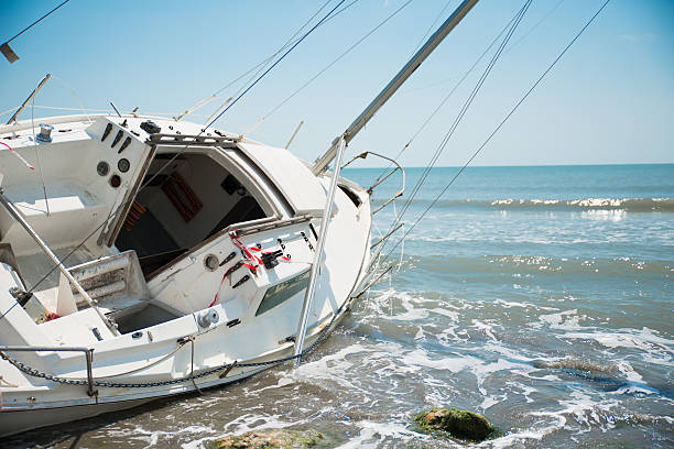 istock sailboat wrecked and stranded on the beach 477057812