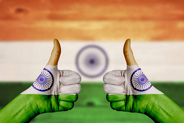 istock India flag painted on female hands thumbs up 477061872