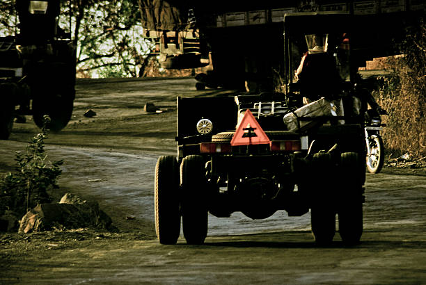 istock New Truck without Body Construction with Warning tiangle on road 477062656
