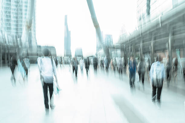 istock motion blur people in business area 477065494