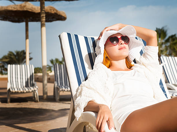 istock Young woman enjoying sun 477069971