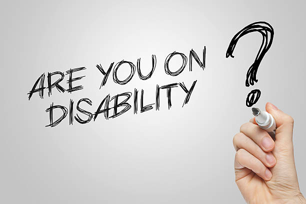 istock Hand writing are you on disability 477074156