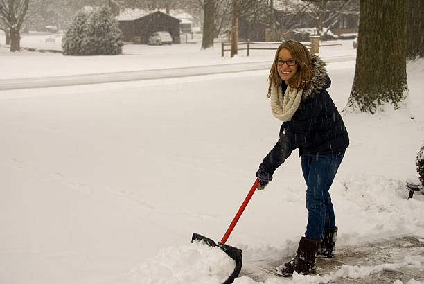 istock Shoveling Snow Happy 477077546