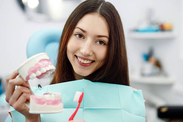 istock Girl with toothbrush in hand and teeth 477085736