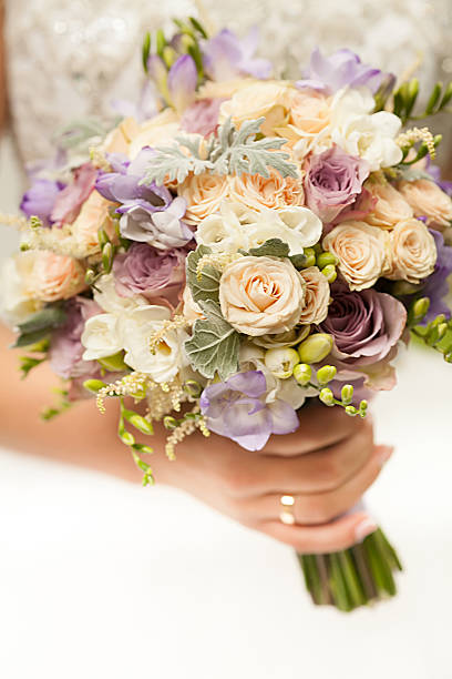 istock Beautiful wedding flowers in hands 477088170
