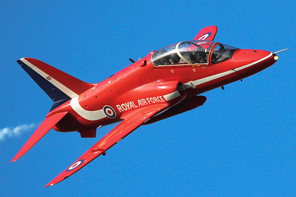 Red Arrows - single Hawk jet Lincoln, UK - January 16 2014: A single BAe Hawk of the Red Arrows during a winter training flight over RAF Scampton. british aerospace stock pictures, royalty-free photos & images