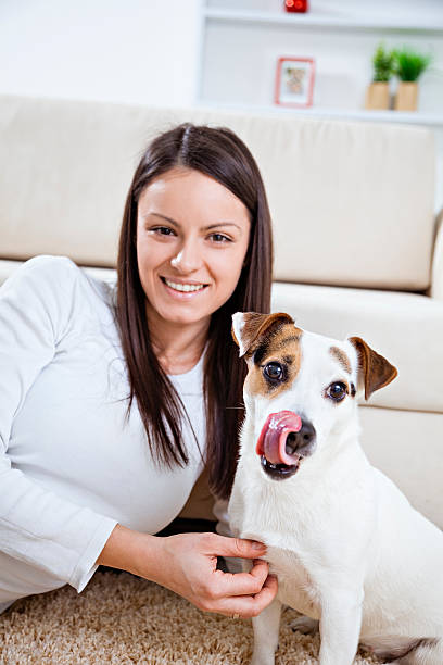 istock Young woman with her dog 477089047