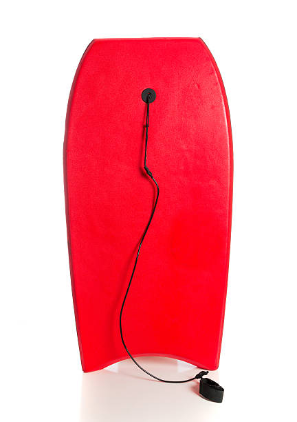 Red boogie board on a white background stock photo