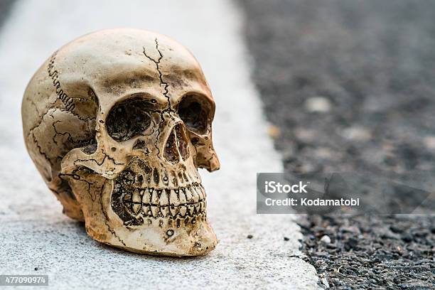 Road Death Concept Skull On The Asphalt Road Street Stock Photo - Download Image Now