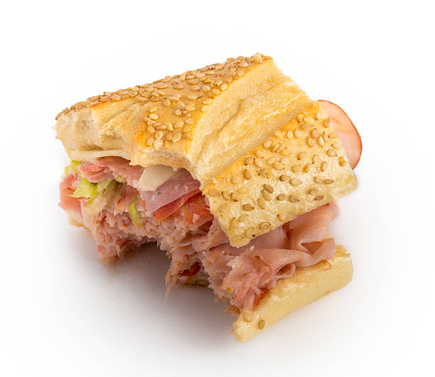 bitten sandwich - sandwich submarine sandwich ham bun stock-fotos und bilder