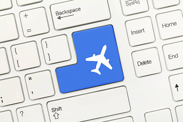 istock White conceptual keyboard - Blue key with airplane symbol 477091628