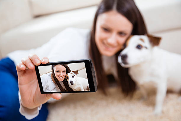 istock Young woman with her dog 477093673