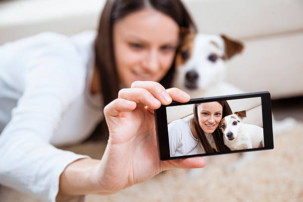 istock Young woman with her dog 477093697