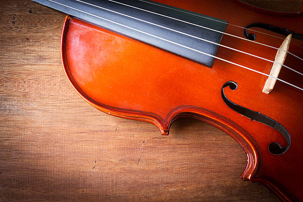 istock Violin on wooden background. 477095762