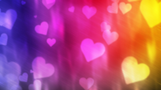 Defocused lights background with glowing hearts and HAPPY VALENTINE'S DAY text. Can be used as a design for Valentine's day holiday greeting cards or posters.