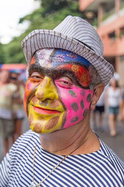 Street Carnival in Rio Rio de Janeiro, Brazil - March 1, 2014: Clown is photographed few minutes before Ipanema Band 50th Parade nudie suit stock pictures, royalty-free photos & images