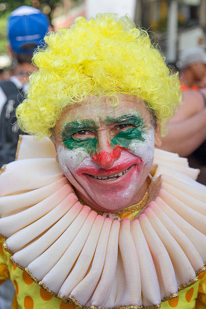 Street Carnival in Rio Rio de Janeiro, Brazil - March 1, 2014: Clown is photographed few minutes before Ipanema Band 50th Parade nudie suit stock pictures, royalty-free photos & images