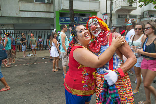 Street Carnival in Rio Rio de Janeiro, Brazil - March 2, 2014: Couple of clowns photographed few minutes before Simpatia e Quase Amor group parades in Ipanema district streets nudie suit stock pictures, royalty-free photos & images