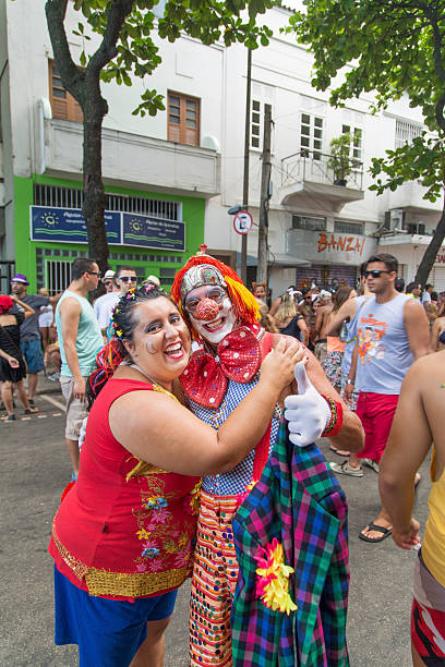 Street Carnival in Rio Rio de Janeiro, Brazil - March 2, 2014: Couple of clowns photographed few minutes before Simpatia e Quase Amor group parades in Ipanema district streets nudie suit stock pictures, royalty-free photos & images