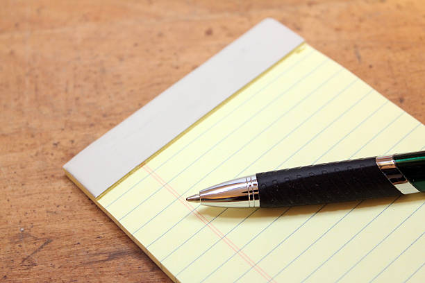 Note pad with pen stock photo