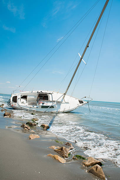 istock sailboat wrecked and stranded on the beach 477104002