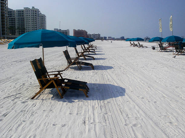 istock beach chairs with umbrellas open on beach 477104304