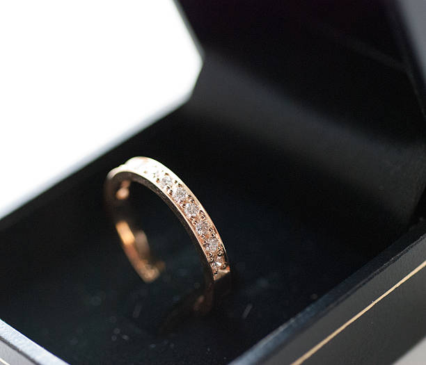 Diamond engagement / wedding ring. Red gold. stock photo